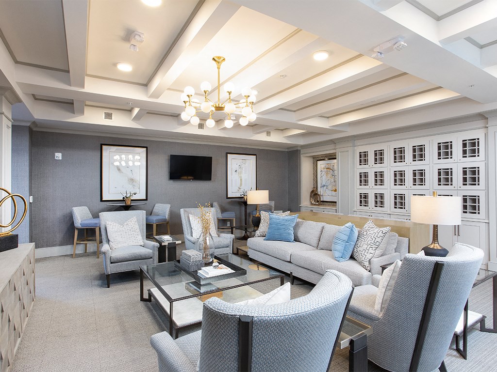 Community room with wine lockers and sofas at St Mary's Square North Apartments, Raleigh, NC, 27605