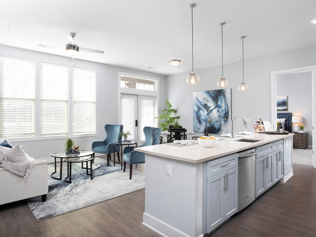 Kitchen with island and living room in background at St Mary's Square North Apartments, Raleigh, North Carolina
