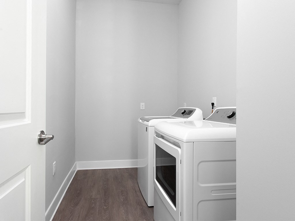 Full size washer and dryer in laundry room at St Mary's Square North Apartments, Raleigh, 27605