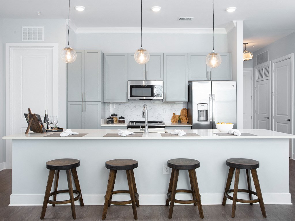 Kitchen island with bar stool seating  at St Mary's Square North Apartments, Raleigh, North Carolina