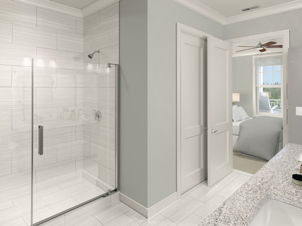 Bathroom with glass shower doors at St Mary's Square North Apartments, Raleigh, NC, 27605