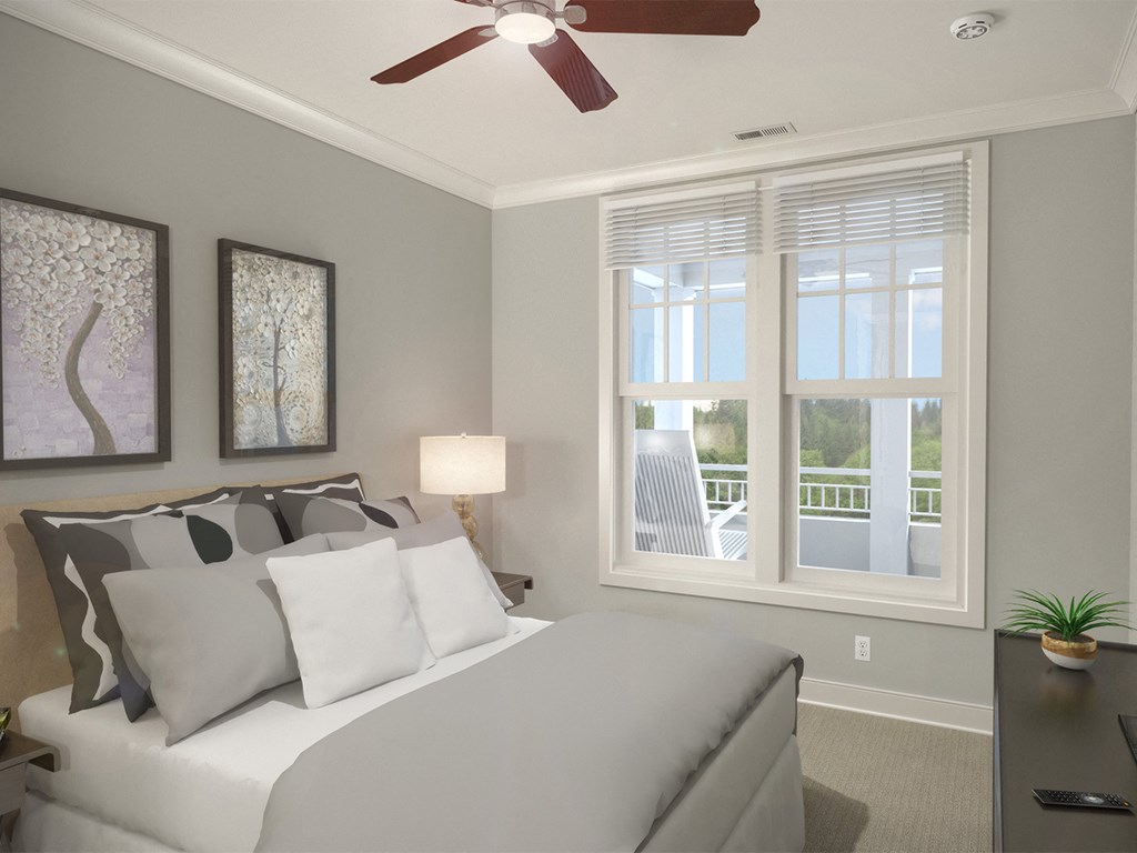 Guest bedroom with bed and window at St Mary's Square North Apartments, North Carolina, 27605