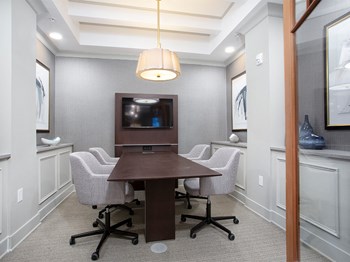 Conference room with table and seating at St Mary's Square North Apartments, Raleigh - Photo Gallery 32