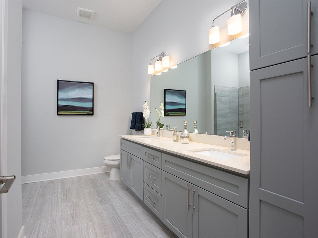 Primary bathroom with vanity at St Mary's Square North Apartments, North Carolina, 27605