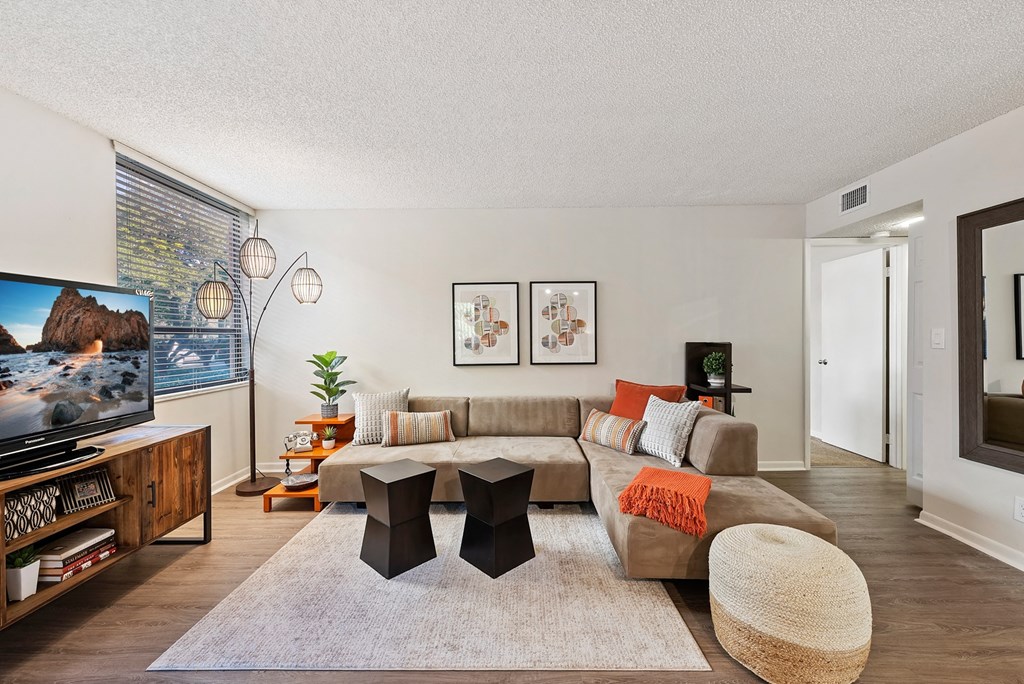 a living room with a couch and a tv