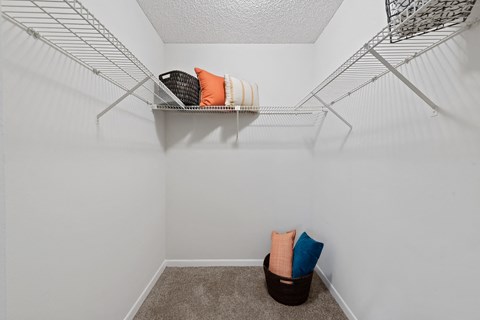 our spacious closets are stocked with towels and baskets in our spacious walk in closet