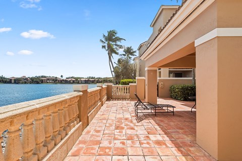 a balcony with a view of a body of water