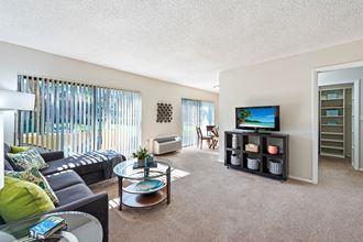 a living room with a couch and a tv