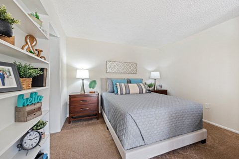 the preserve at ballantyne commons bedroom with bed and shelves
