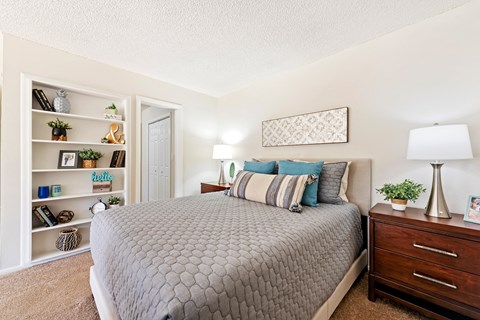 the preserve at ballantyne commons bedroom with bed and shelves