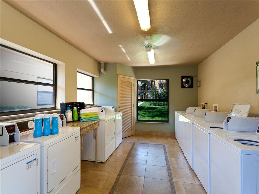 a laundry room with washes and dryers in it