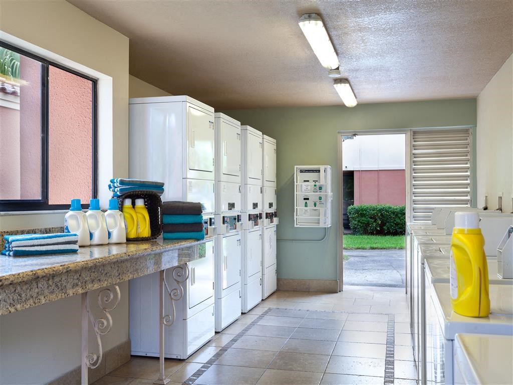 a kitchen with white cabinets and a counter top