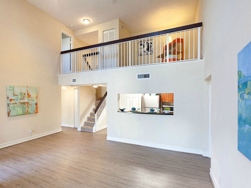 a view of a living room and a staircase in a house