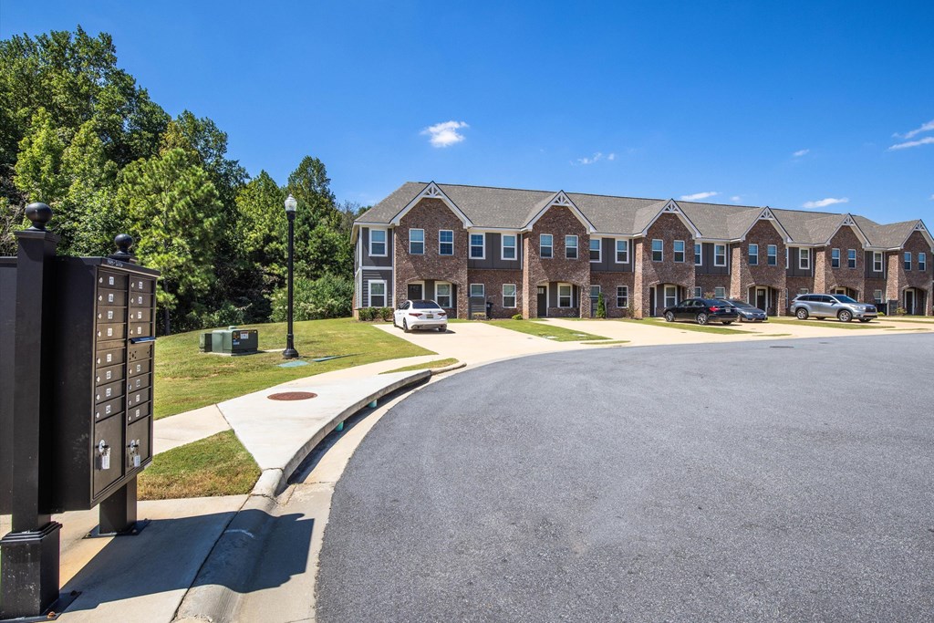 A large building with a parking lot in front of it.