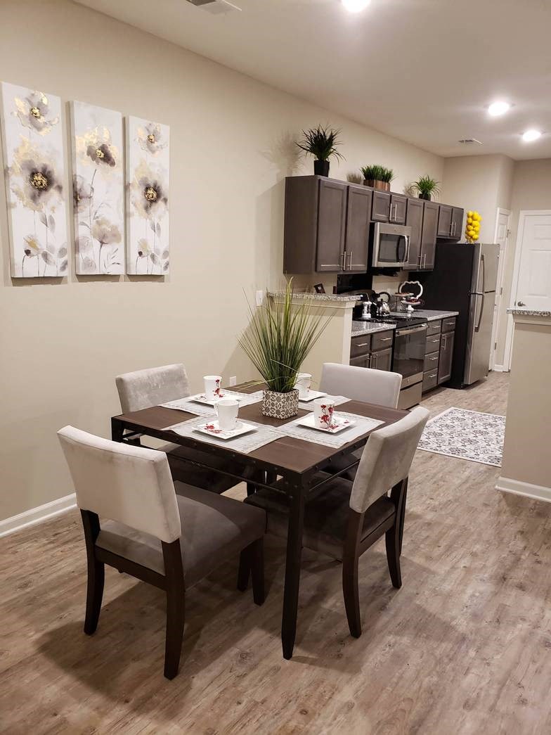 a dining room with a table and chairs