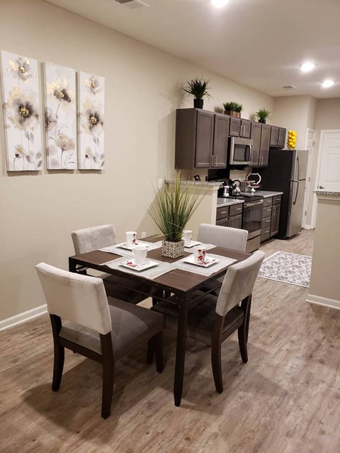a dining room with a table and chairs