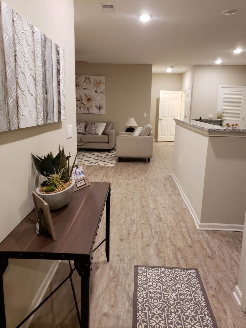 a living room and a kitchen with a table