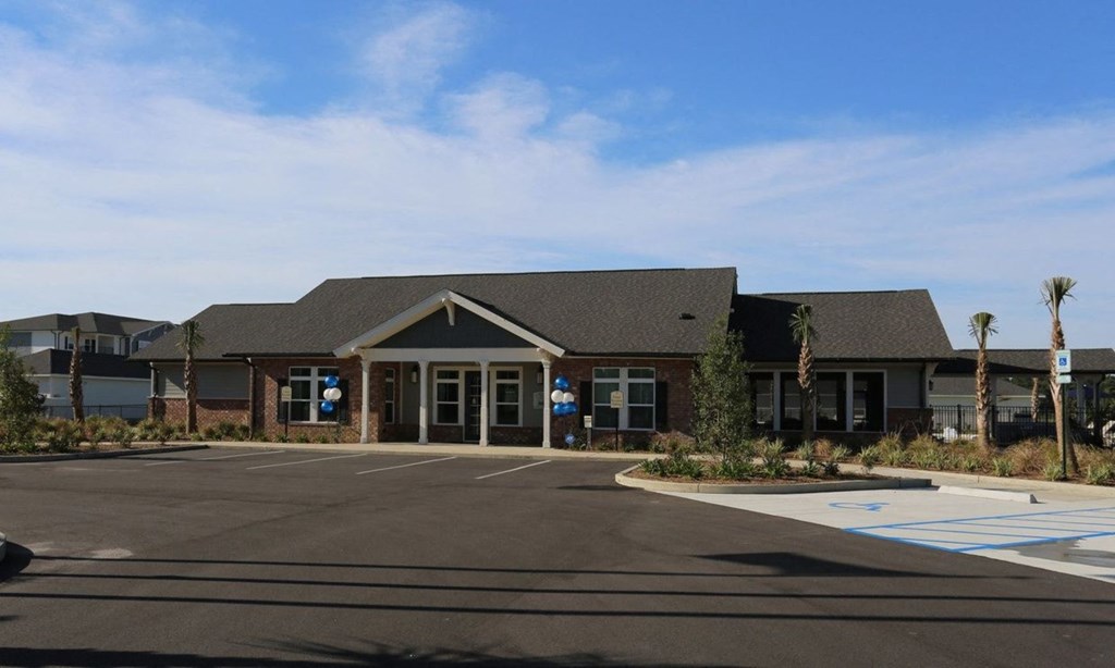 an empty parking lot in front of a building