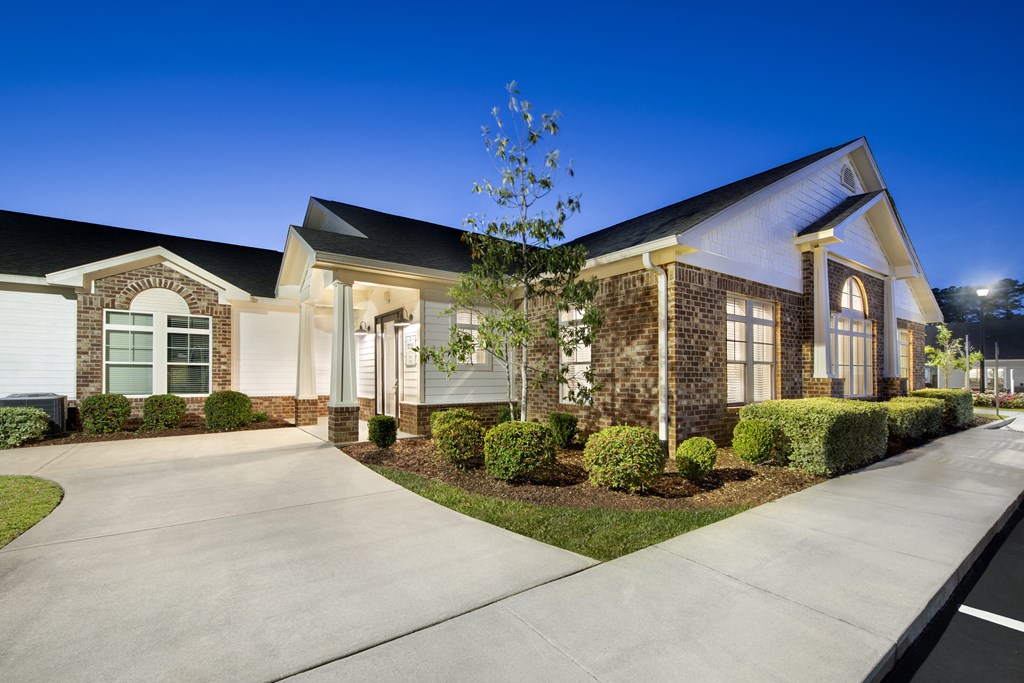 a house with a sidewalk in front of it