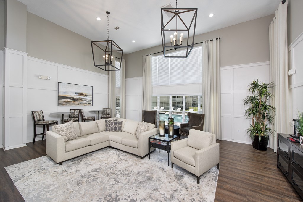 a living room with couches and chairs and a table
