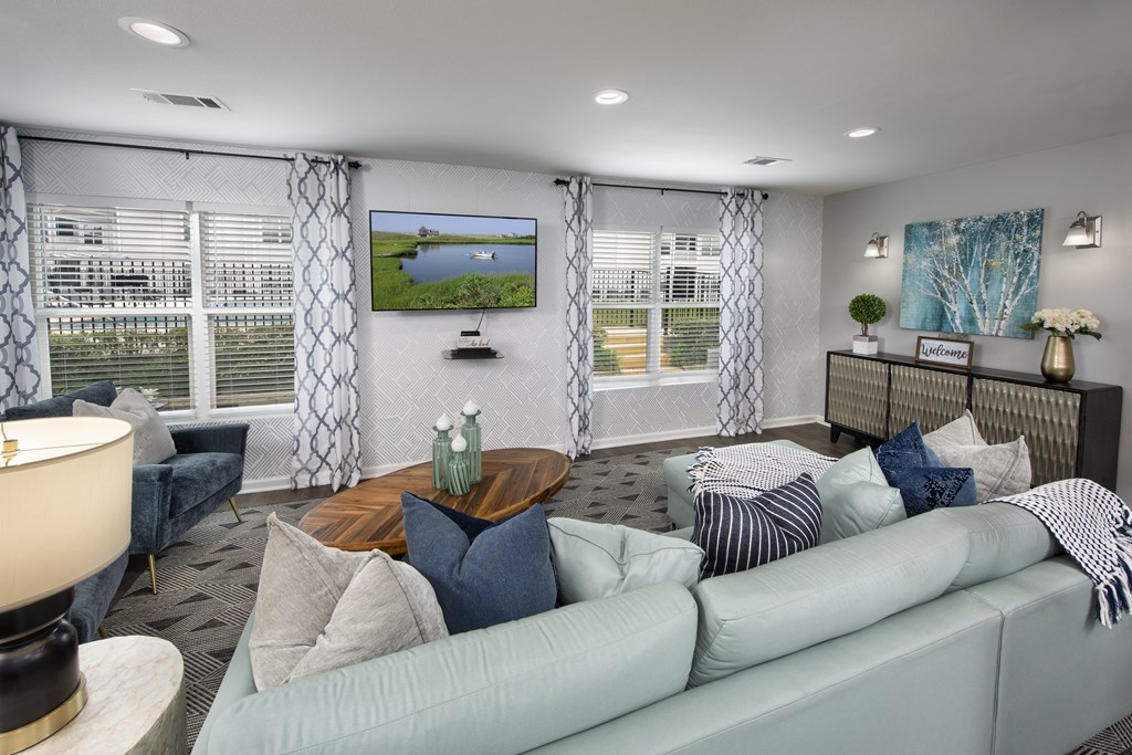 a living room with a white couch and a table