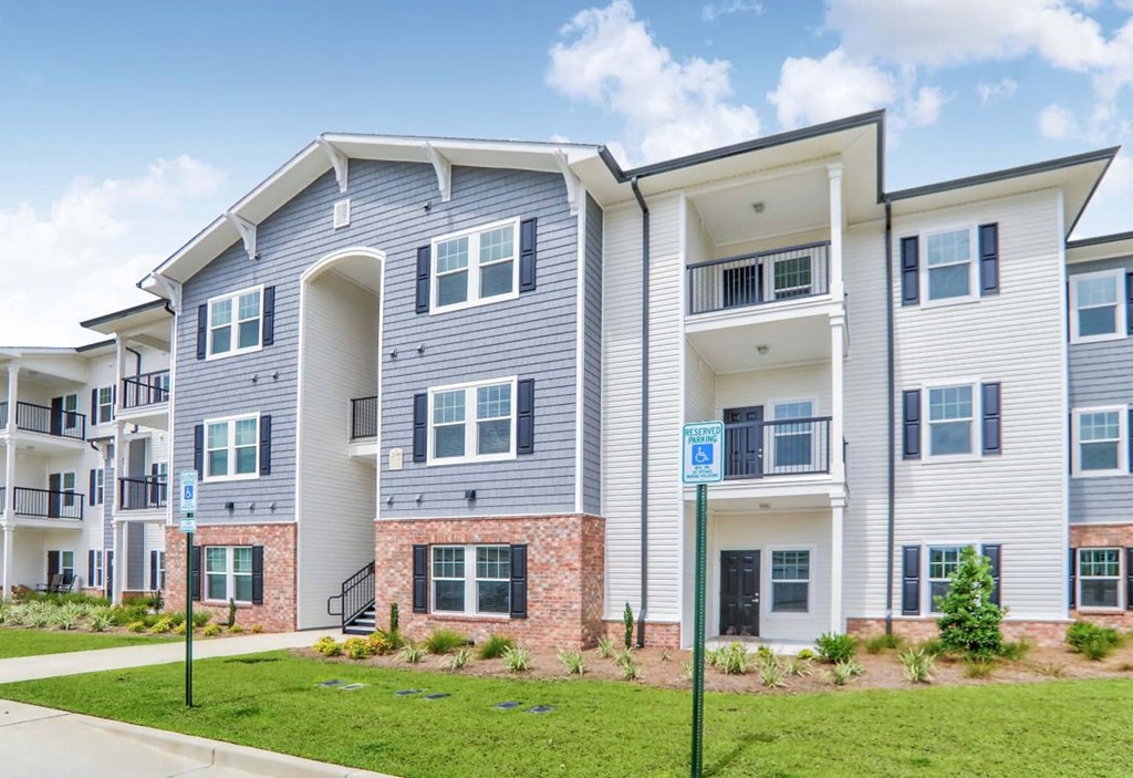 the outlook of two story apartment buildings with balconies