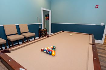 a pool table with a bunch of balls on it