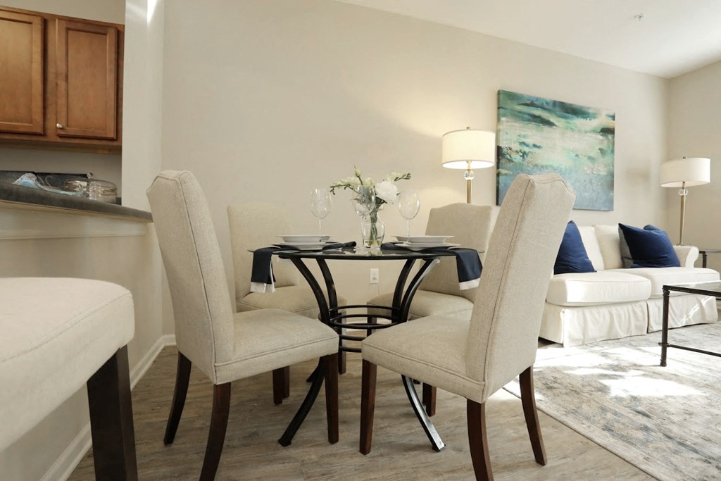 a dining room with a table and chairs