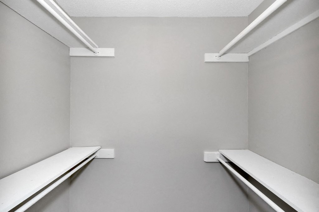 Two white shelves on the wall.