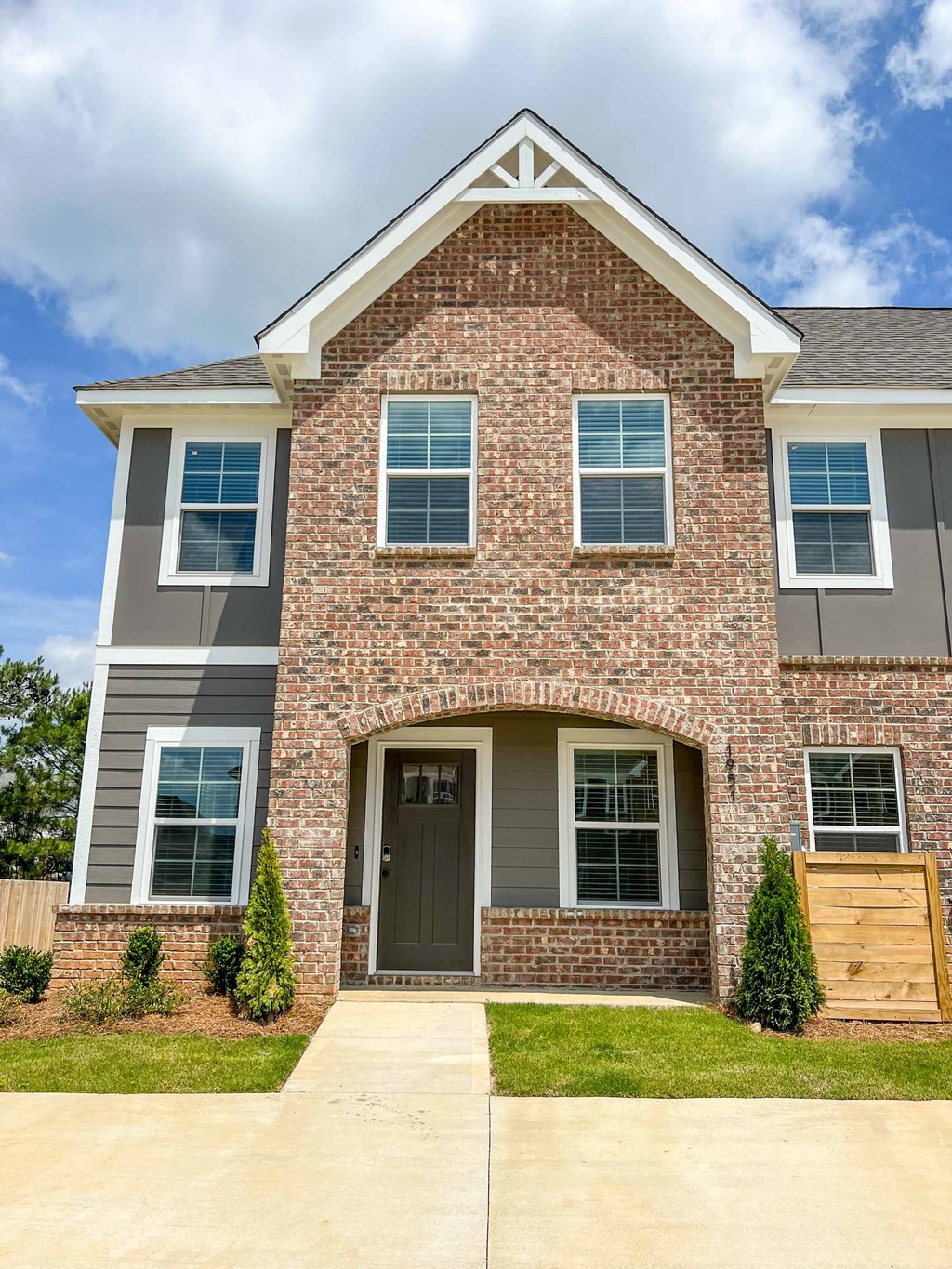 a large brick house with a wooden door