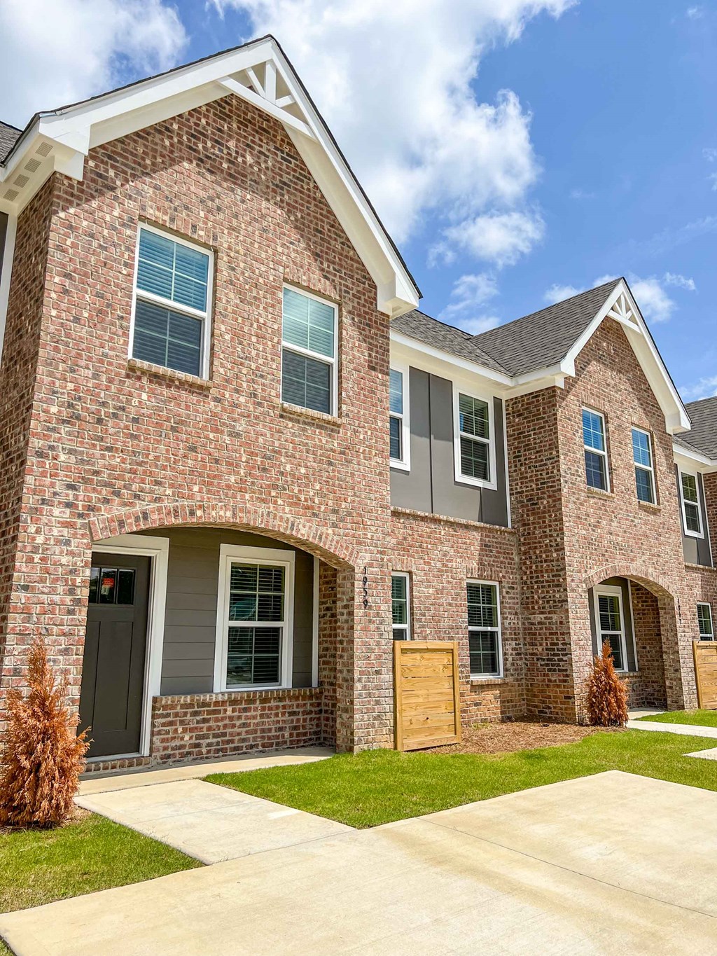 a large brick house with a wooden door
