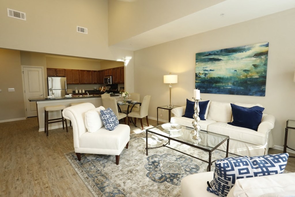 a living room with couches and chairs and a table