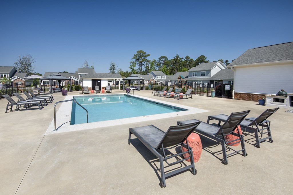 our apartments have a resort style pool and lounge chairs