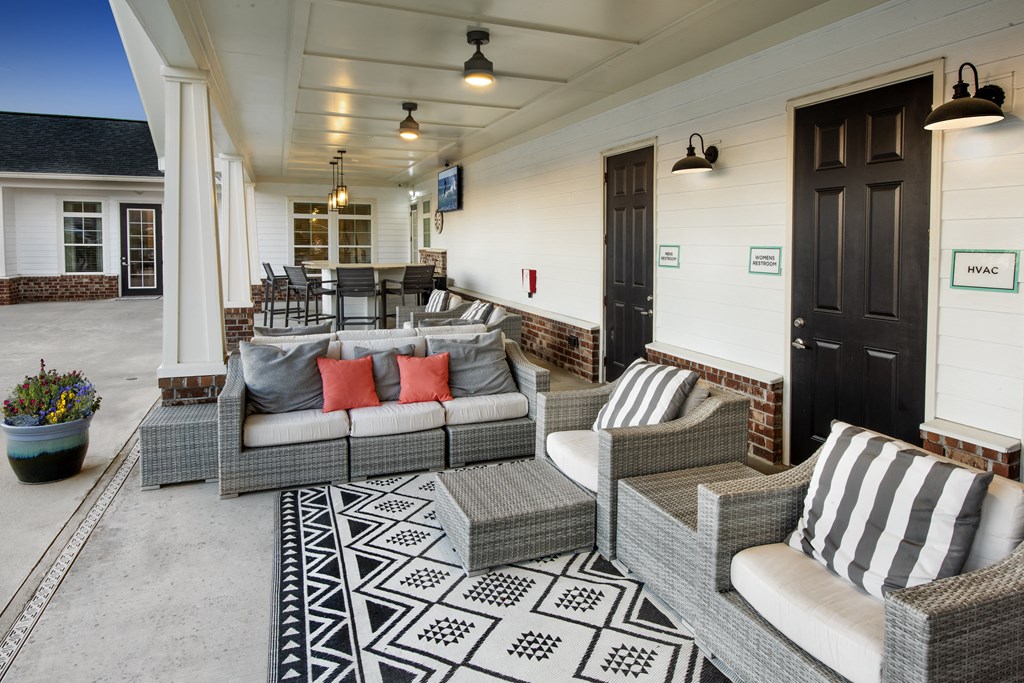 a living room with couches and chairs and a table