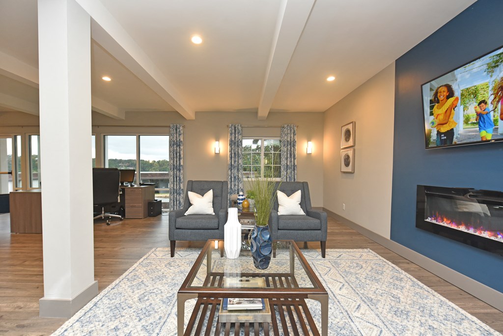 a living room with blue walls and a fireplace