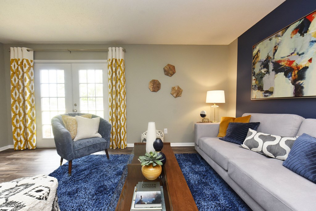 a living room with couches and a coffee table