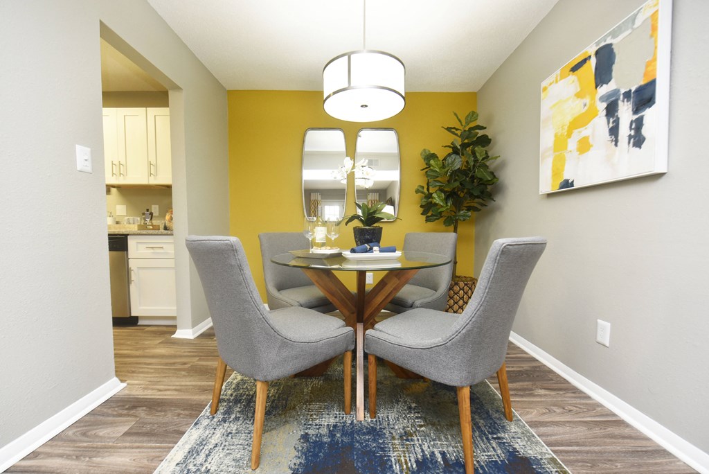 a dining room with a table and chairs
