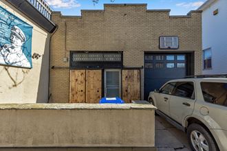 a building with a car parked in front of it