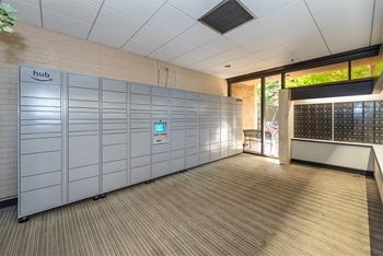 a row of lockers in a room with a wooden floor