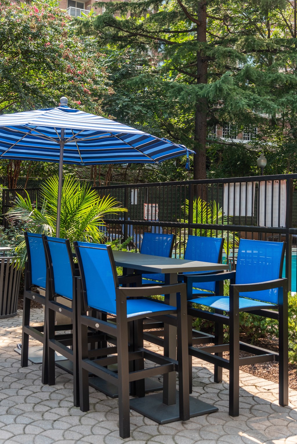 a table and chairs with an umbrella on a patio