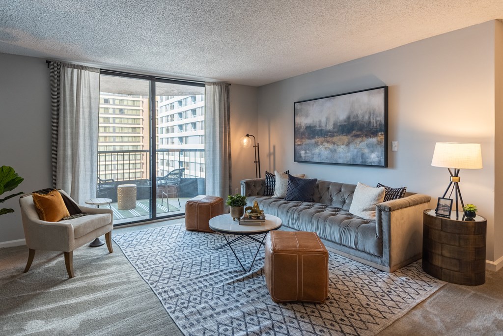 a living room with a large window and a couch