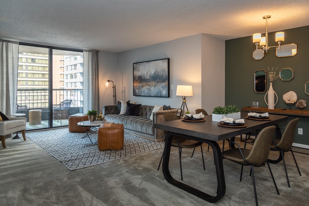 a living room with a dining room table and a couch