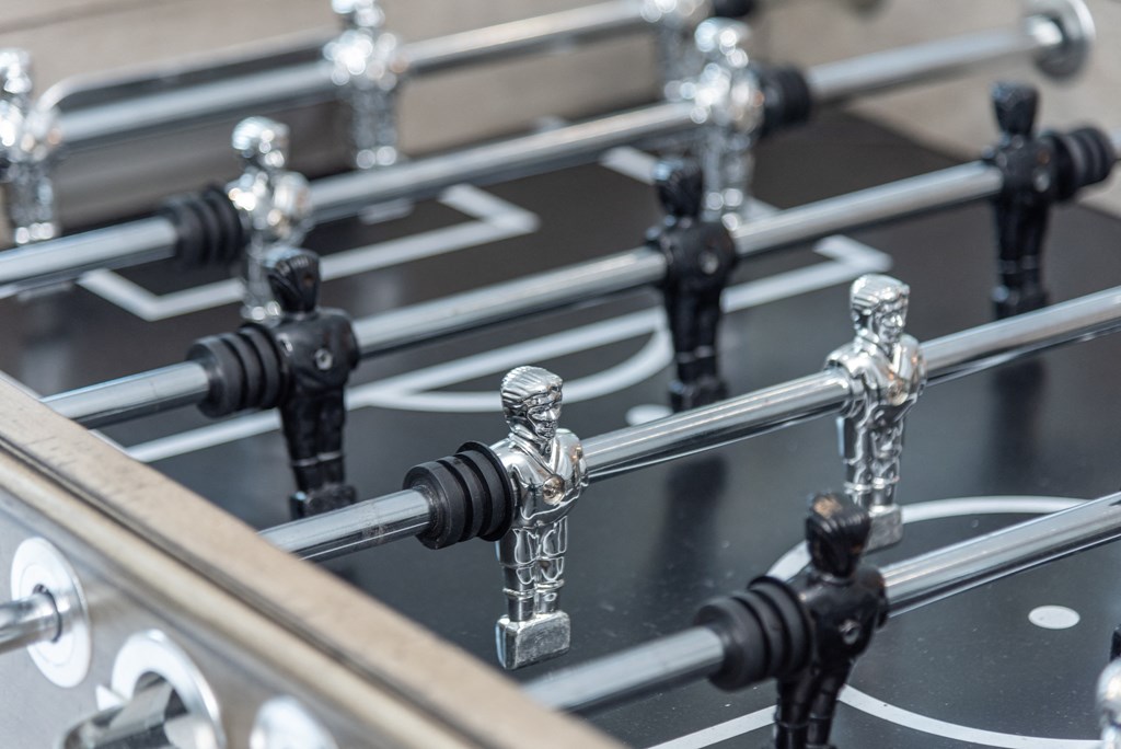 a close up of a glass table top with chess pieces