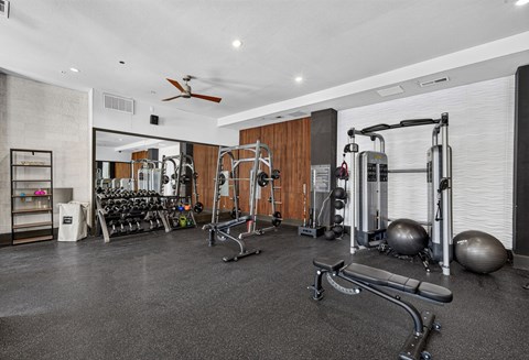 A spacious home gym with a variety of exercise equipment.