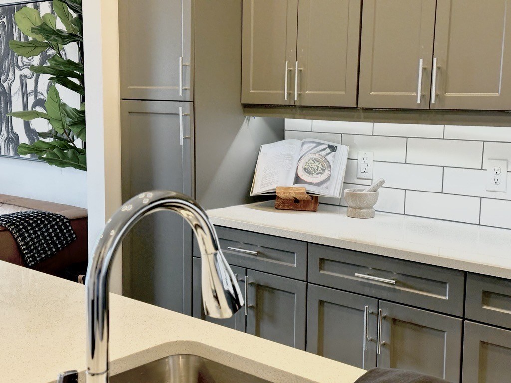A kitchen with a sink and cabinets.