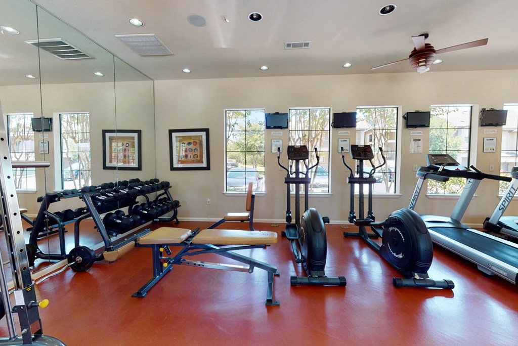 a gym with weights and other exercise equipment