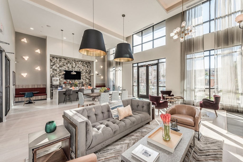 a living room with couches and chairs and a fireplace