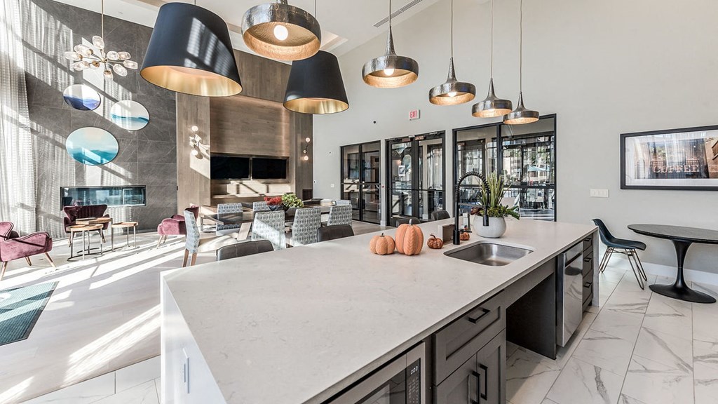 a large kitchen with a counter top and a sink