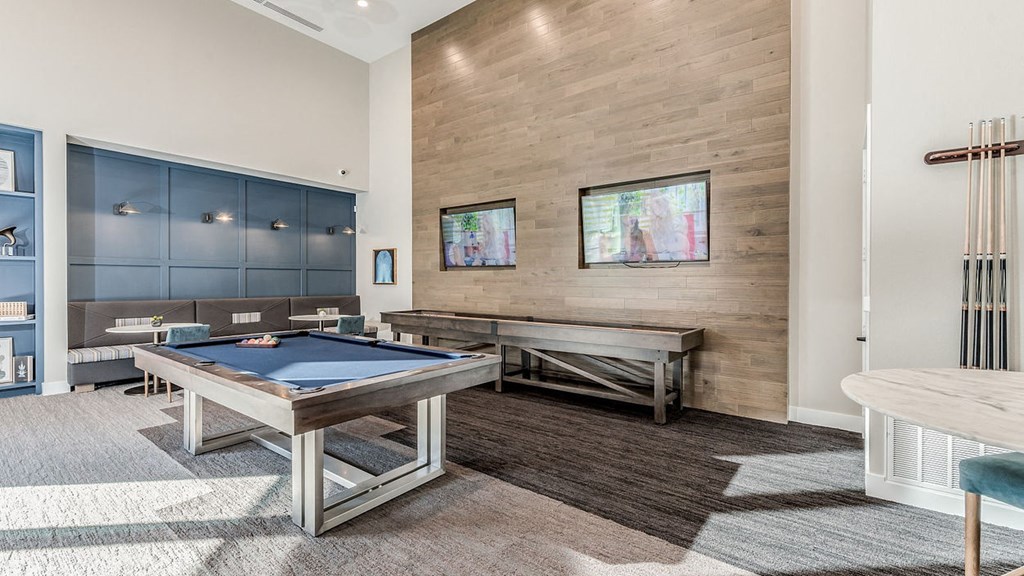 a games room with a pool table