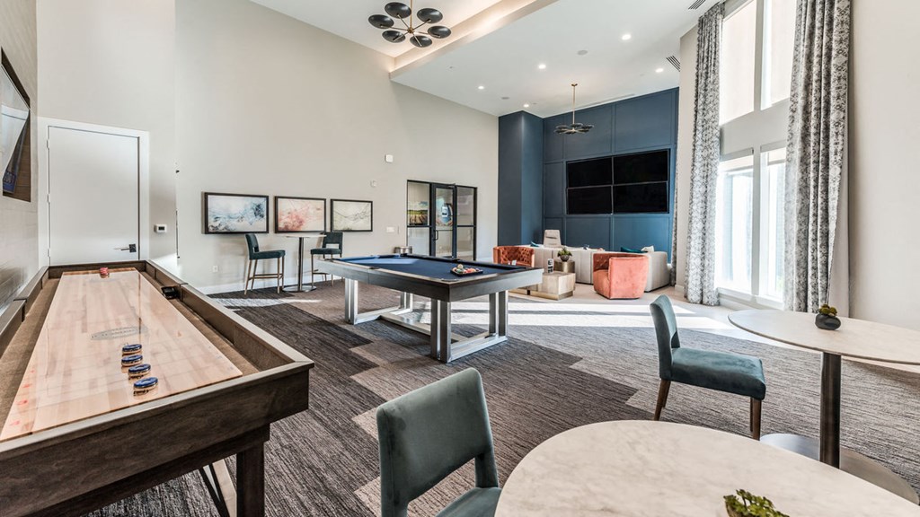 a clubhouse with a pool table and a billiards table